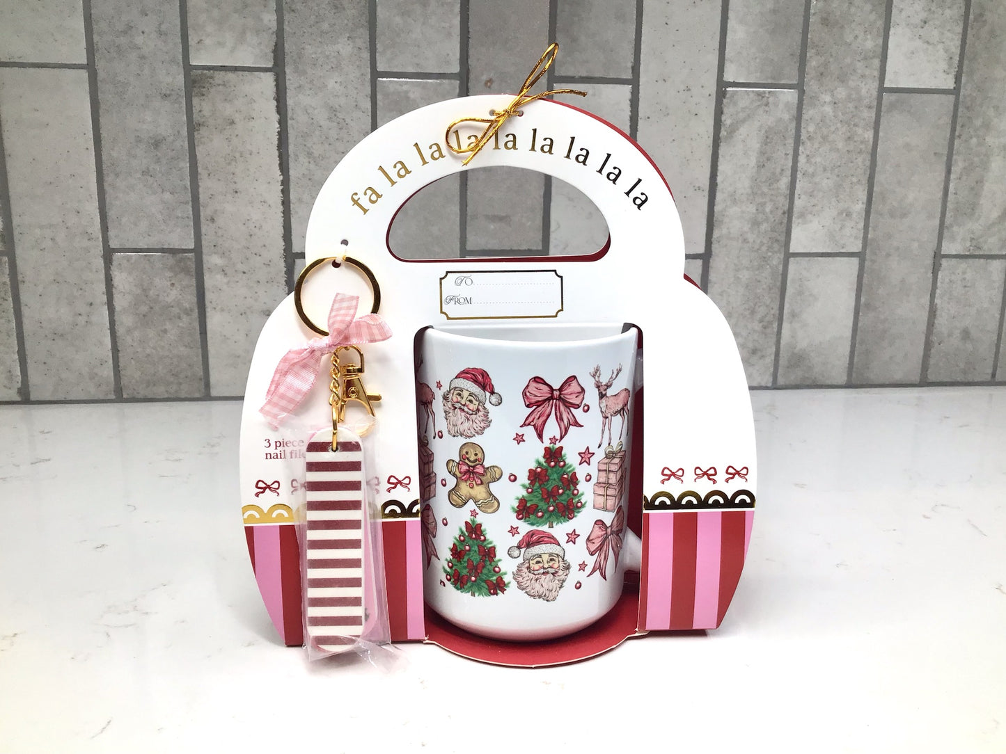 “Nutcracker-themed ceramic mug gift set with red and gold nutcracker artwork and matching nail file keychain.