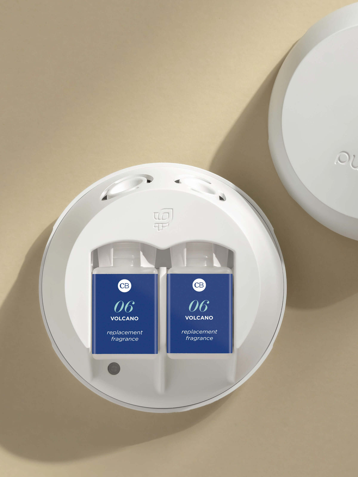 Pura smart home fragrance diffuser loaded with dual Capri Blue Volcano refills