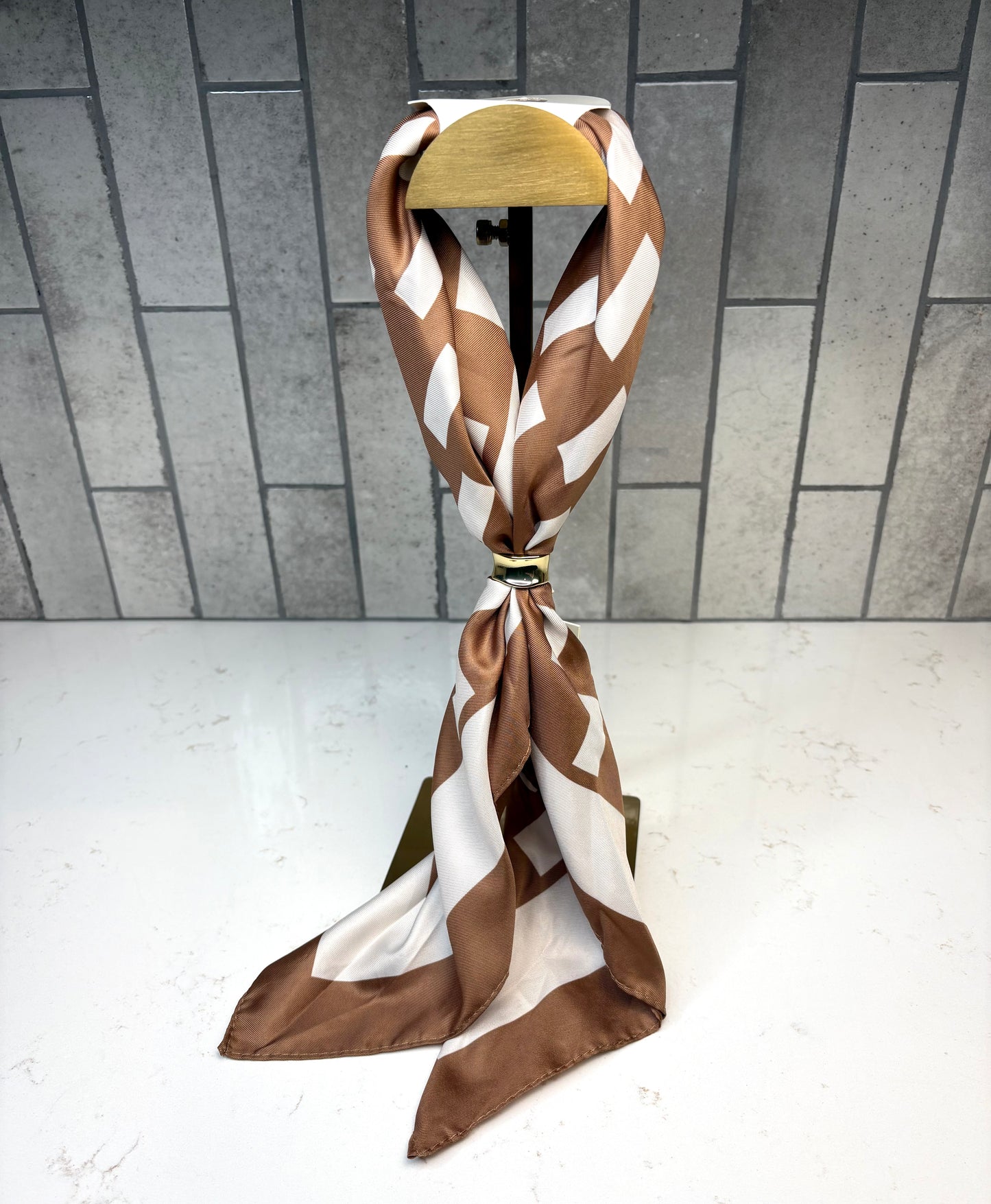 Katie Loxton Satin Multiway Scarf in caramel and off-white checker print satin scarf.