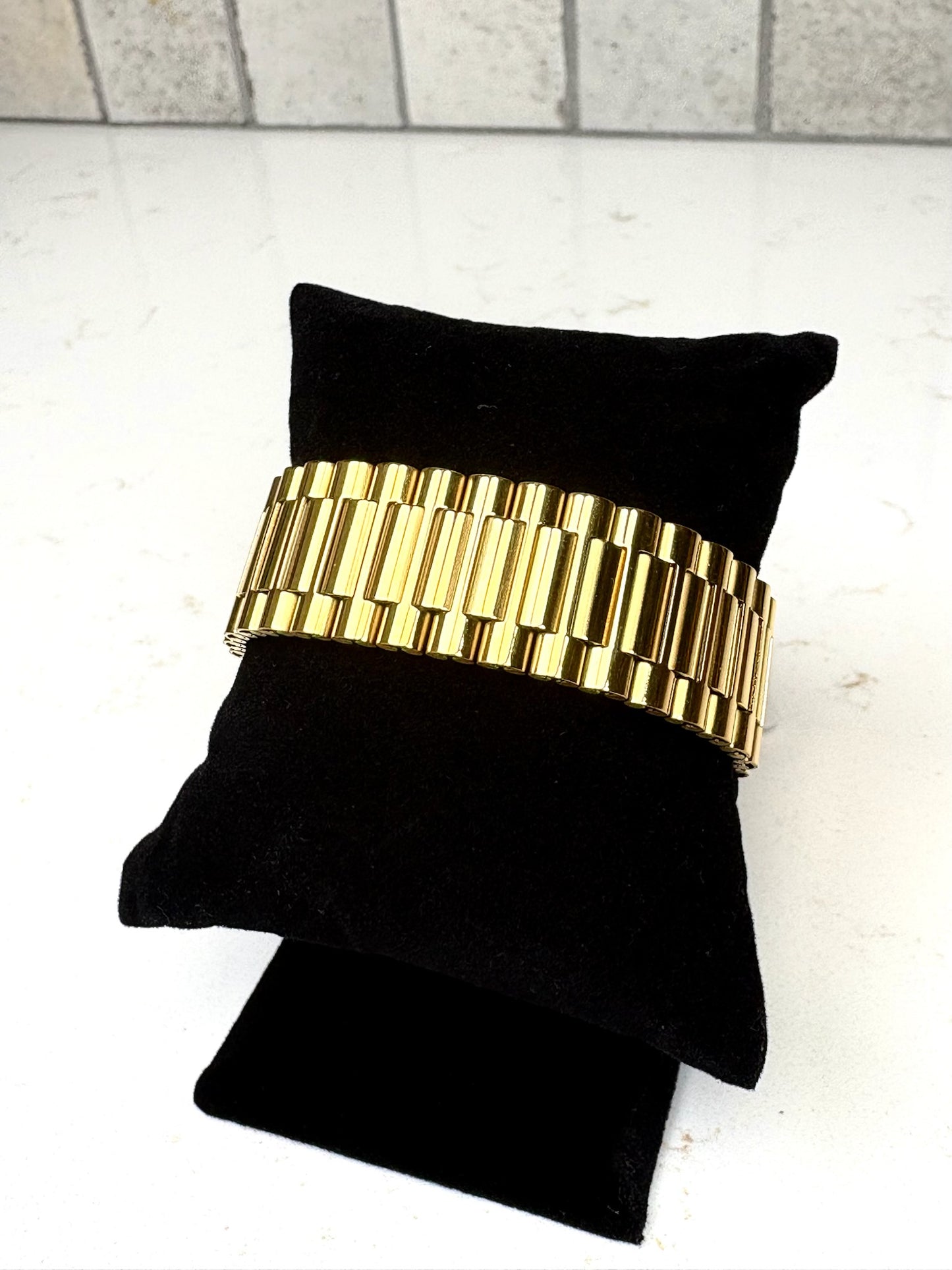 Chan Sutt Pearls gold watch band bracelet angled view, bold gold link bracelet for women statement jewelry