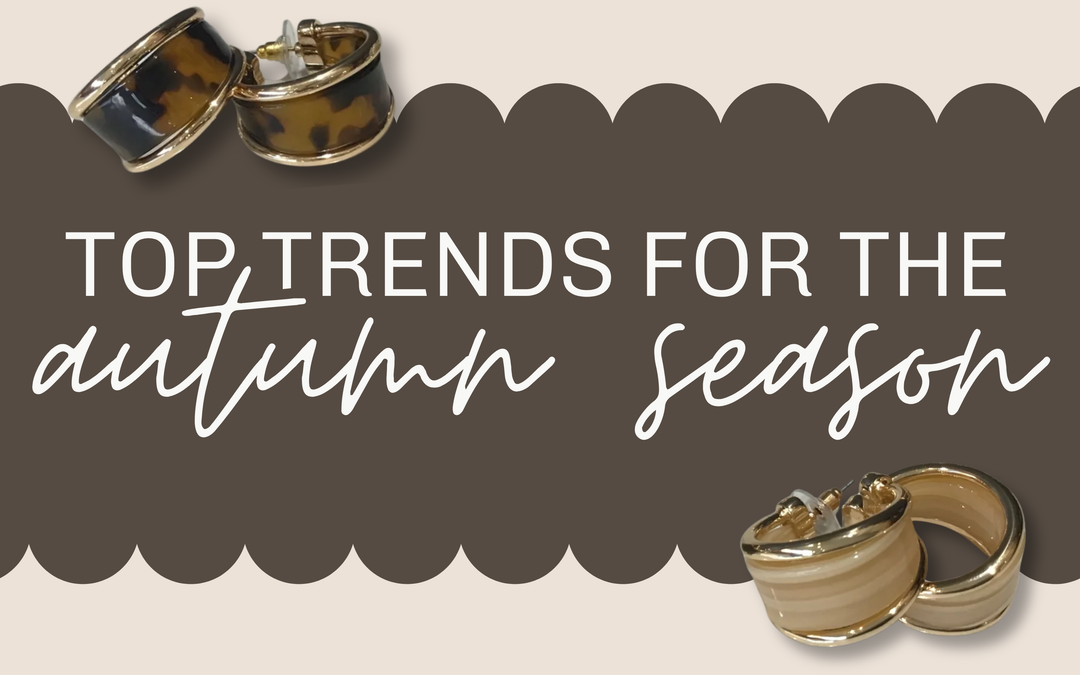 A promotional banner with the text 'TOP TRENDS FOR THE autumn season' in white lettering over a dark brown scalloped background, decorated with small fashion accessory illustrations in the corners | Square 1 Boutique | Brent, AL