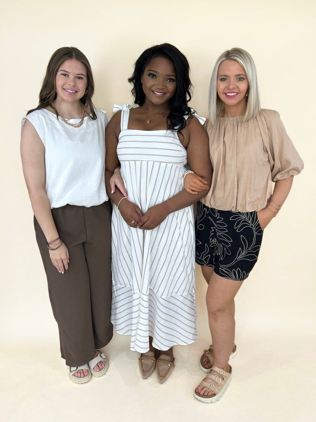 women’s spring clothing collection boutique outfits neutral dresses tops wide leg pants shorts casual fashion trends