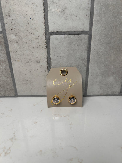 18K gold plated bezel stud earrings with round clear crystal on cream branded jewelry card, minimalist everyday studs