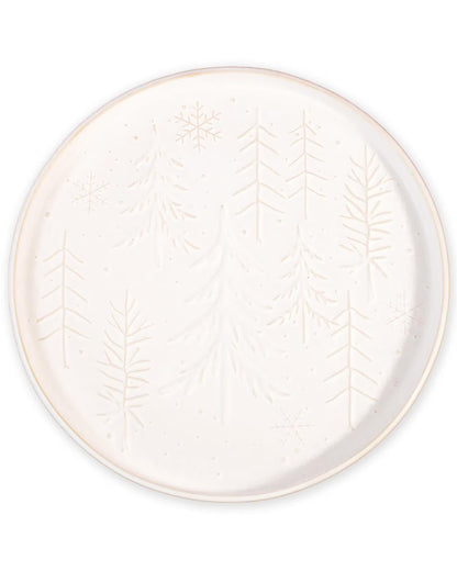 White ceramic plate with leaf pattern on a white background