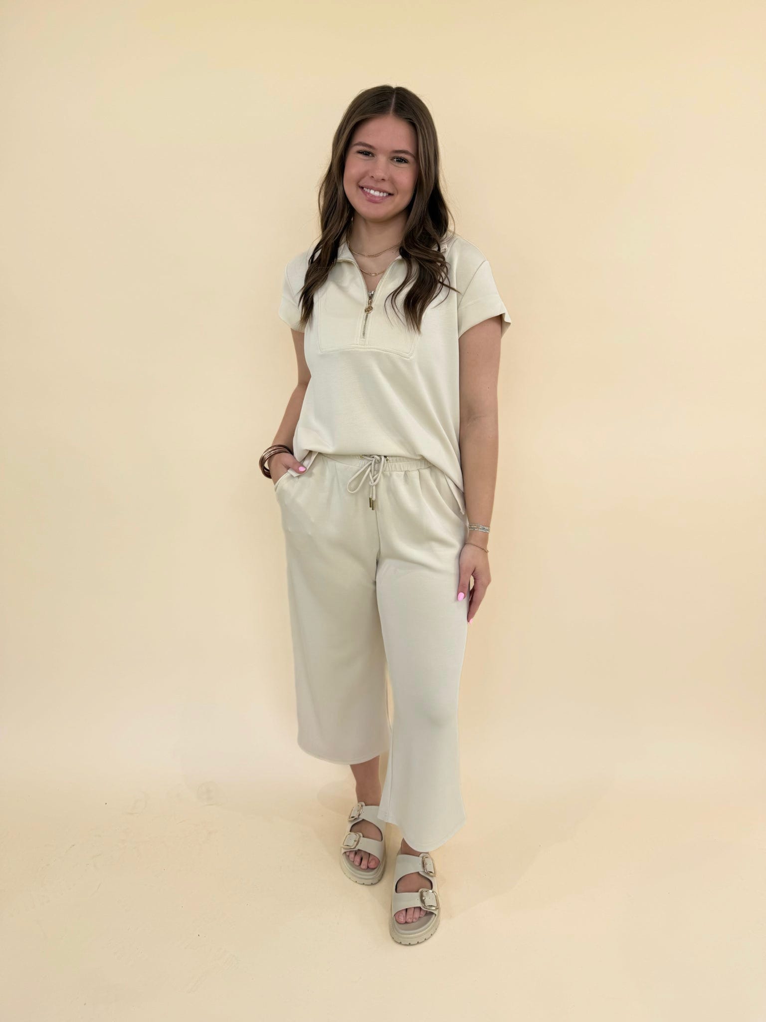 CloudSilk Weekend Set in sand neutral color featuring cap sleeve zip collar top and cropped wide-leg lounge pants