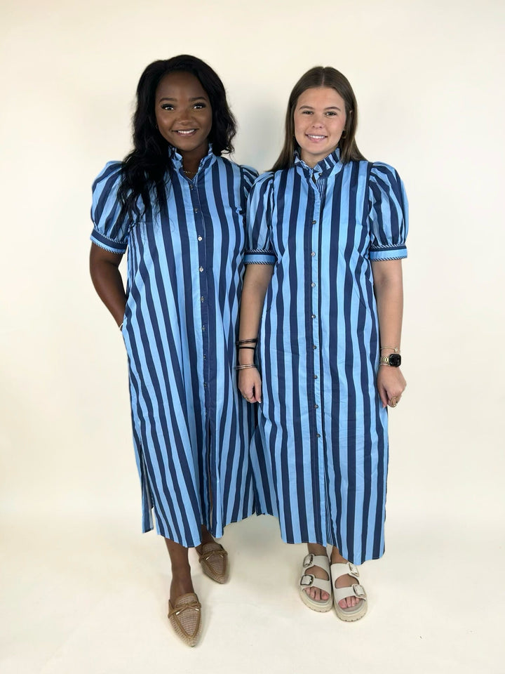 Two models wearing a blue striped button-front midi shirt dress with a ruffle mock neckline, puff sleeves, side pockets, and side slits, showcasing the relaxed fit on different body types.