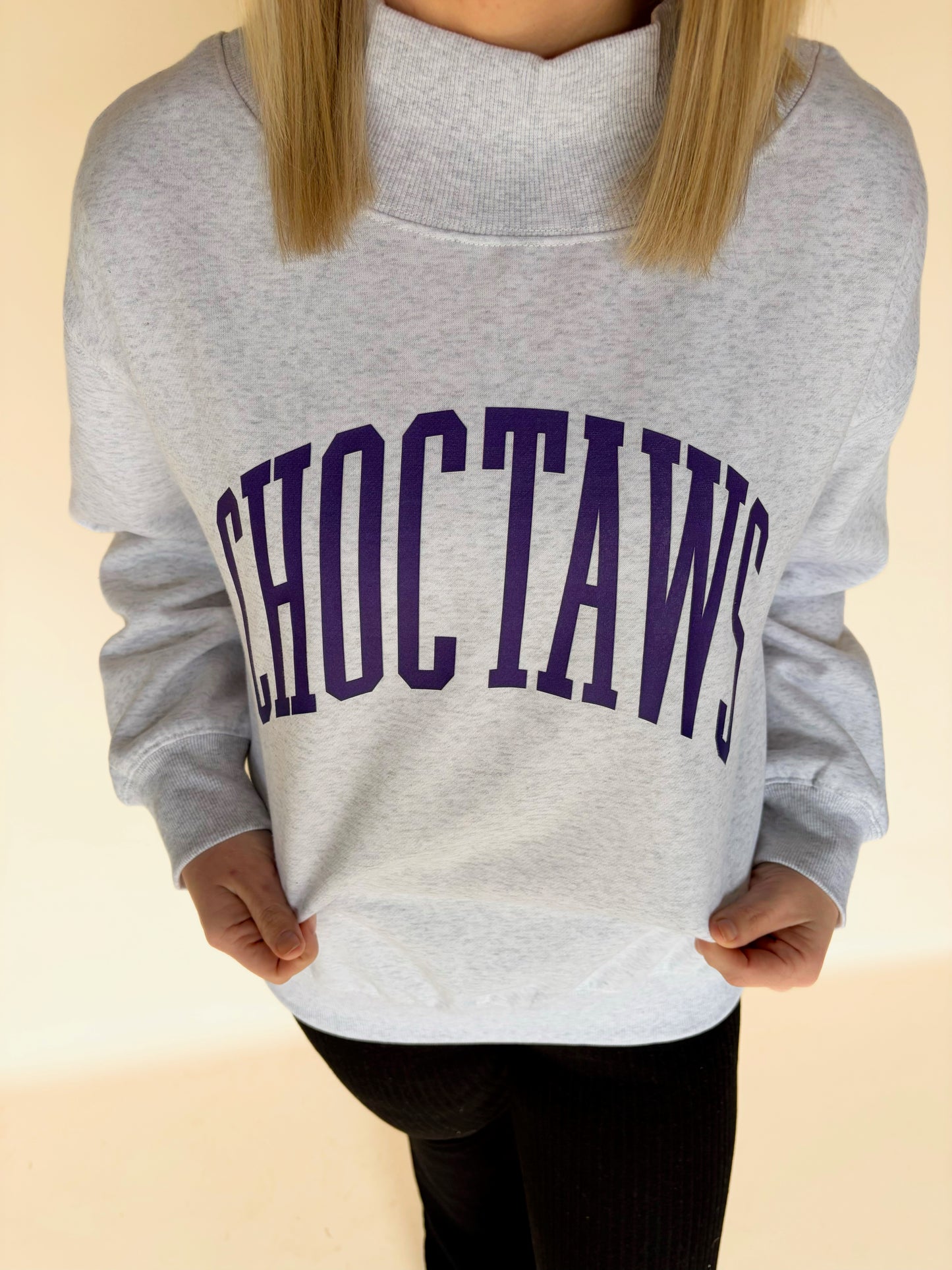 Close-up of light gray mock neck sweatshirt with purple “Choctaws” collegiate lettering, soft fleece crewneck women’s boutique sweatshirt