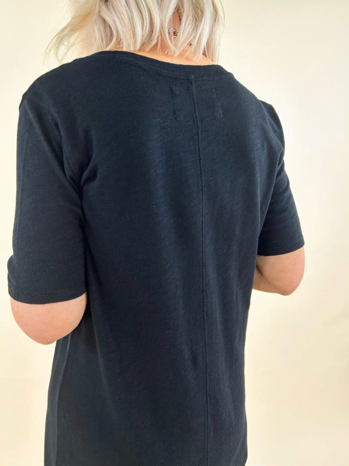 Black midi t-shirt dress back view with center seam detail, casual black lounge dress, women&