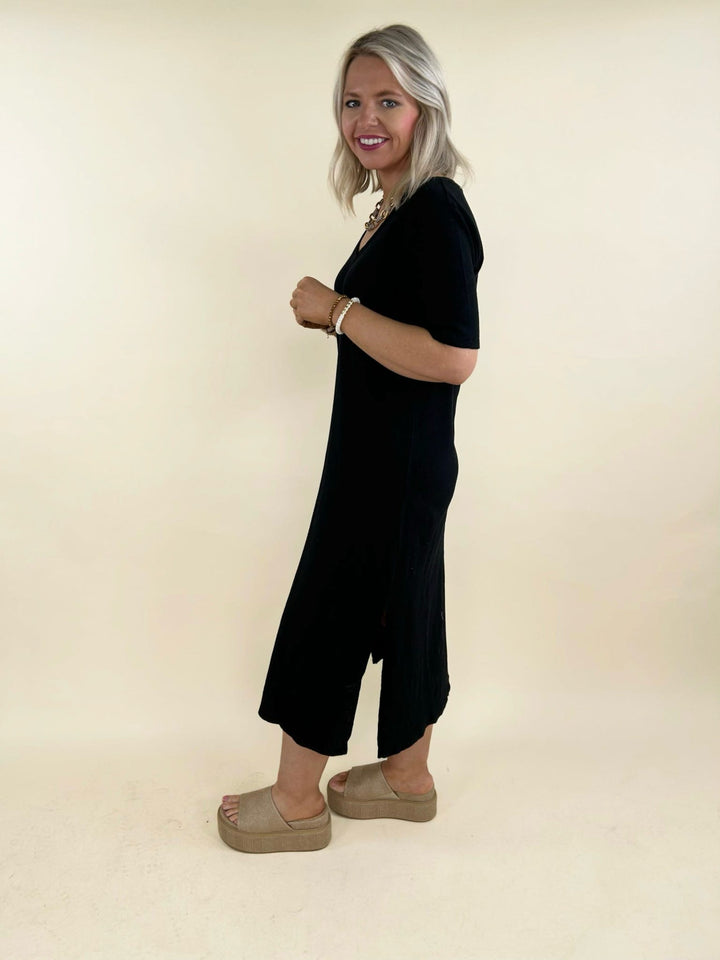 Black v-neck midi dress side view with short sleeves and side slit, women&