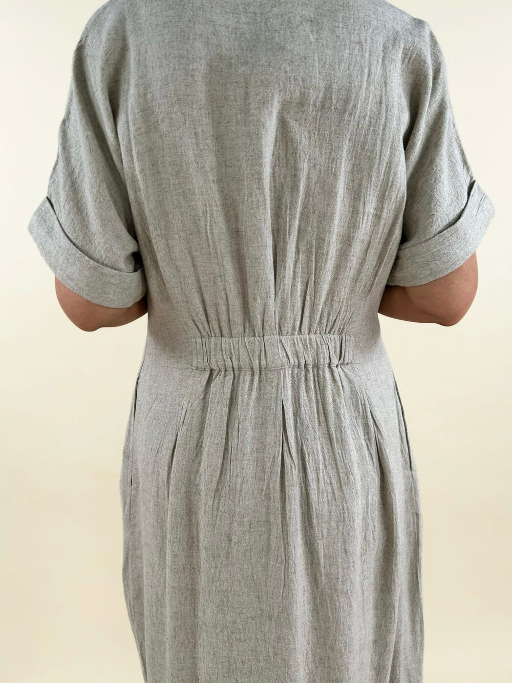 lightweight neutral midi shirt dress back view elastic waist detail short sleeve rolled cuff dress