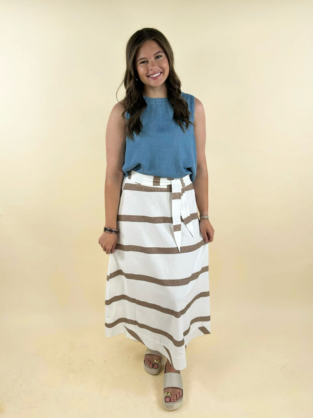 white and taupe striped midi skirt full front view flowy hemline summer outfit women’s boutique fashion