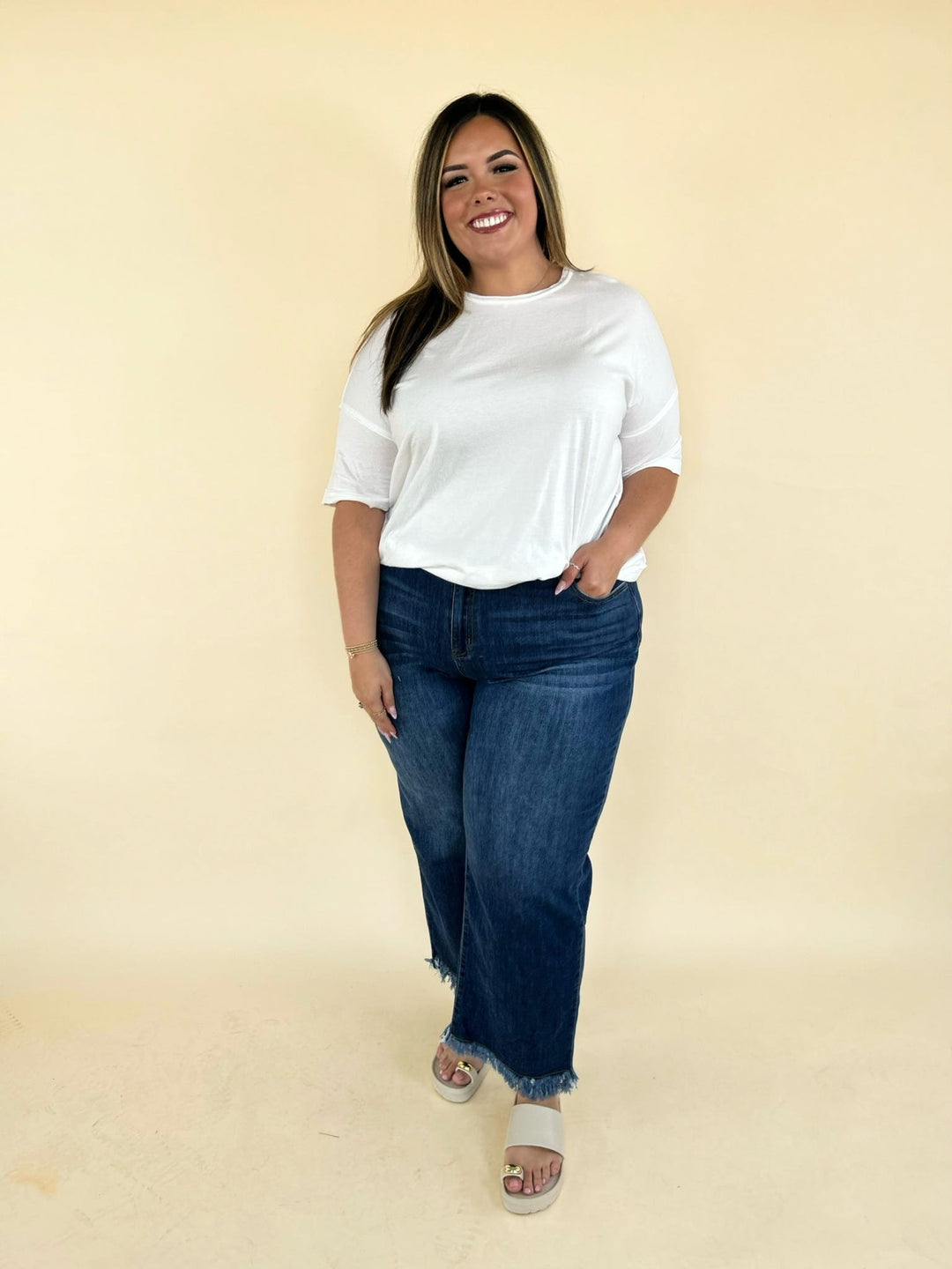 white oversized tee front view with high waisted denim jeans relaxed fit casual outfit women’s boutique