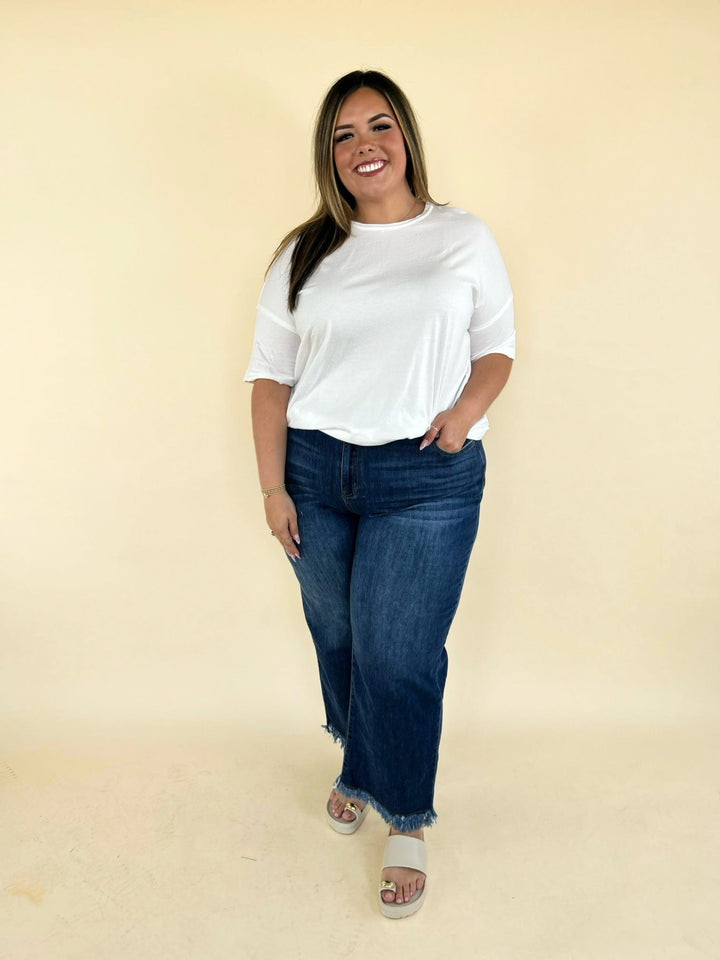 white oversized tee front view with high waisted denim jeans relaxed fit casual outfit women’s boutique