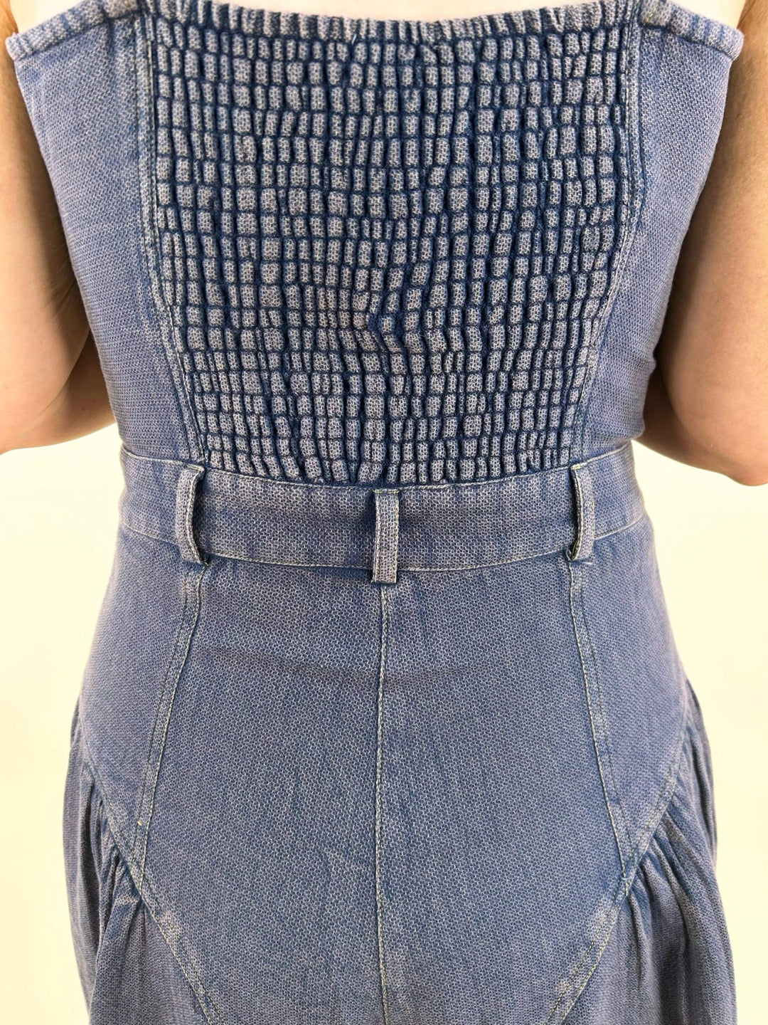 denim blue smocked back jumpsuit detail elastic back waist wide leg women’s boutique outfit