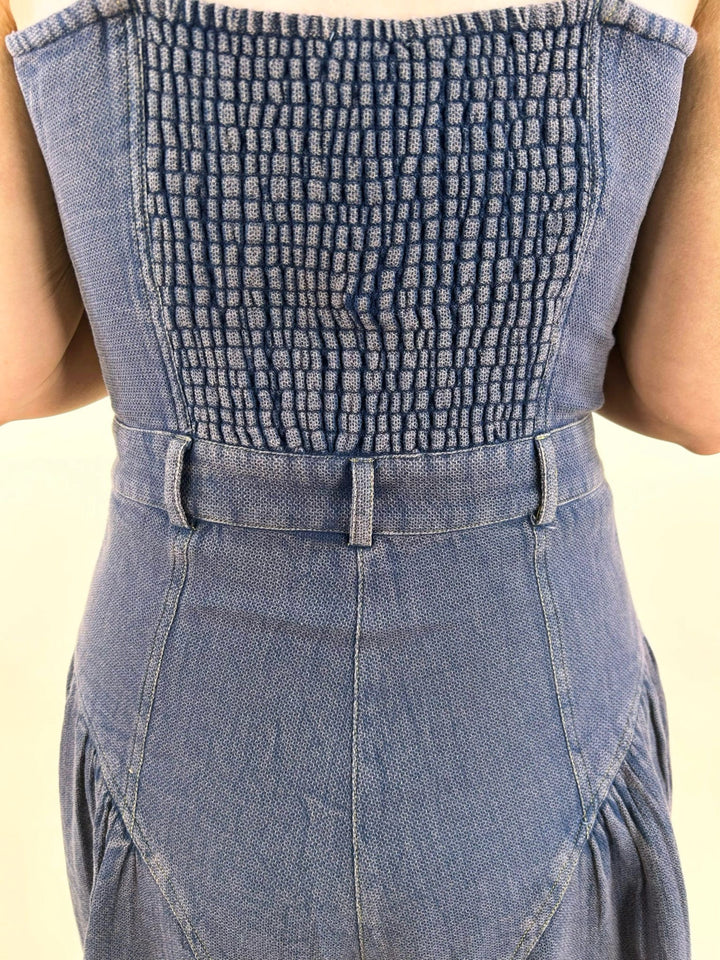 denim blue smocked back jumpsuit detail elastic back waist wide leg women’s boutique outfit