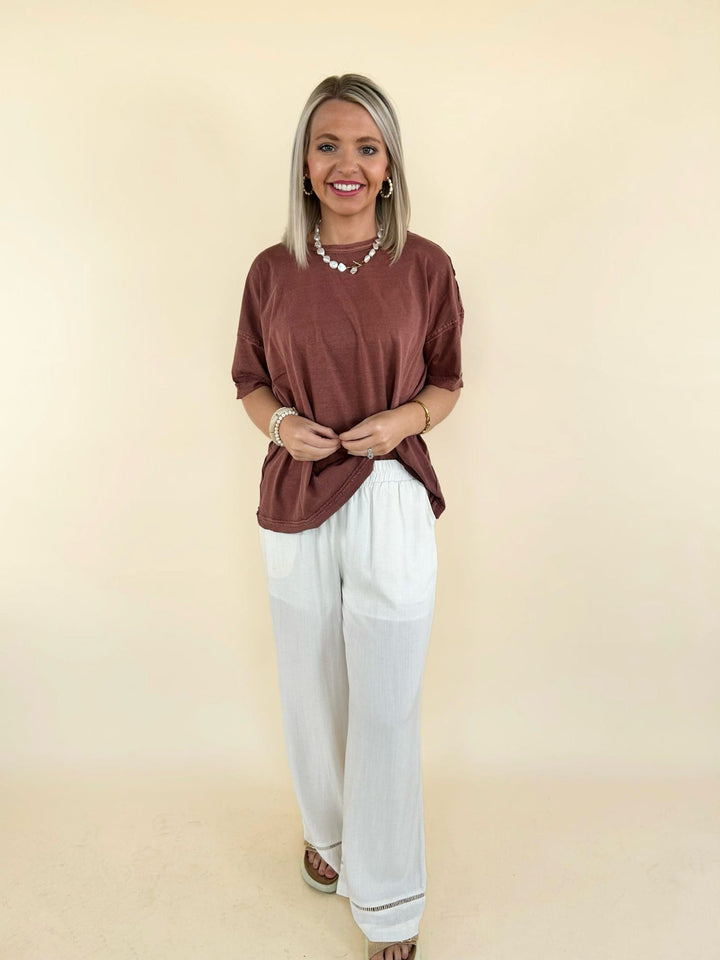 rust oversized tee front view with cream wide leg pants relaxed fit casual outfit women’s boutique
