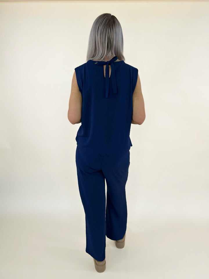 Back full body view of navy matching set with sleeveless top and wide leg pants