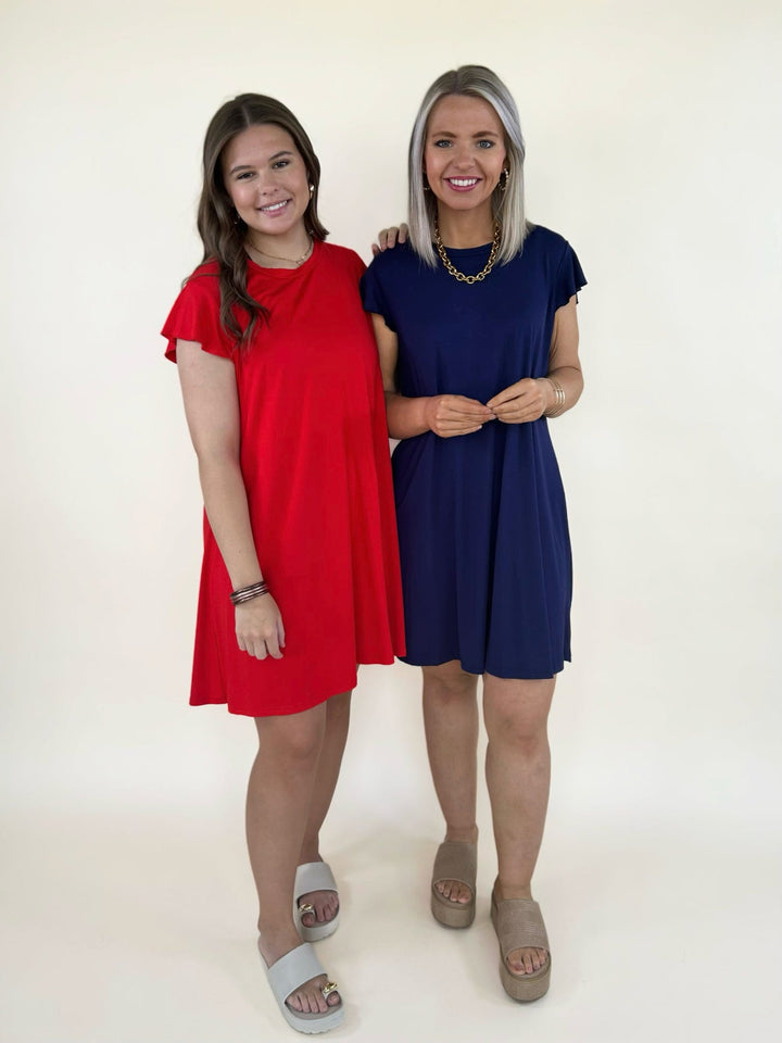 Front view of two women’s casual swing dresses in navy and red with short sleeves and relaxed fit