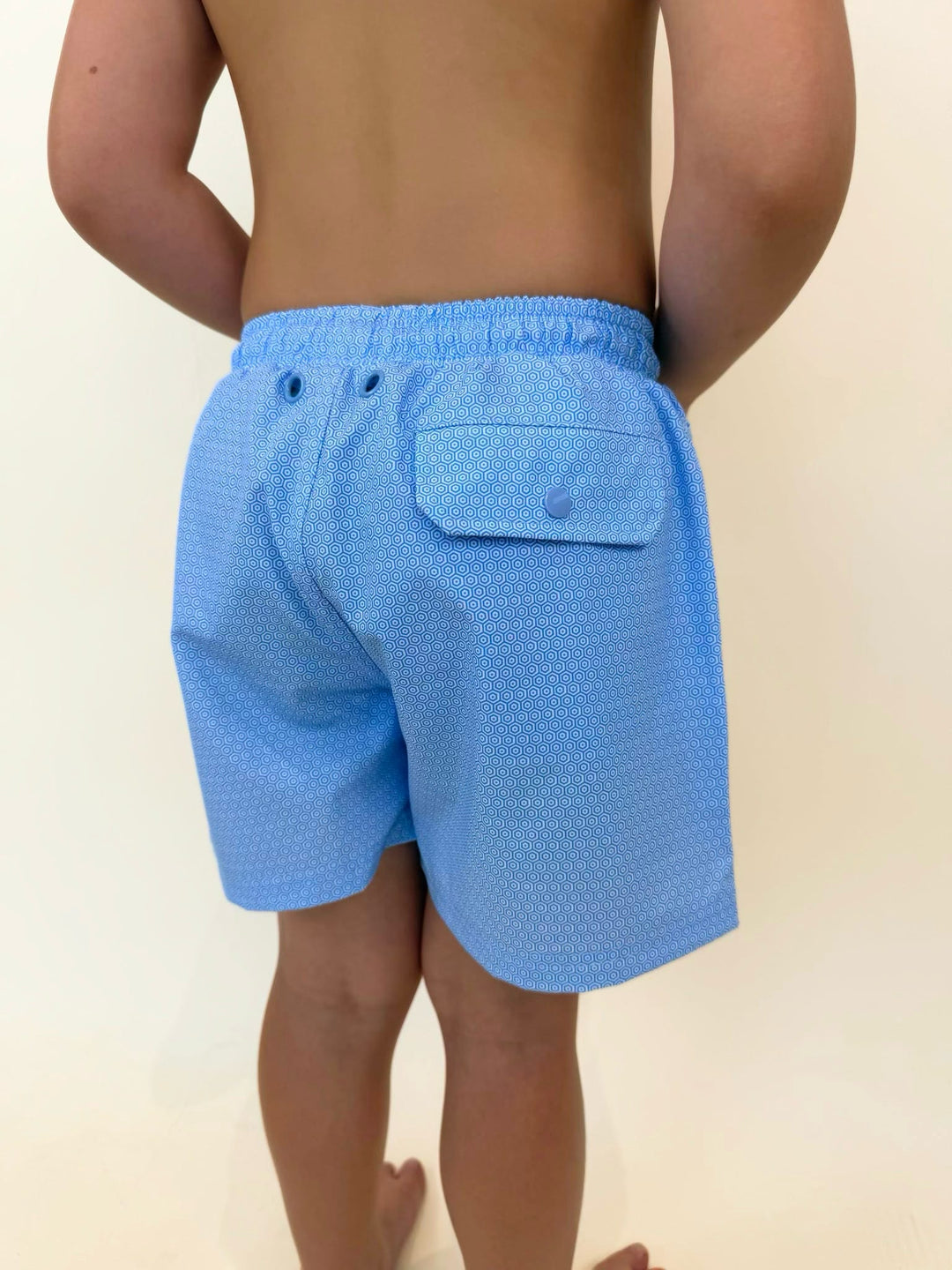 Fieldstone boys swim trunks back pocket detail, youth swim shorts with flap pocket, quick dry boys swimwear, kids patterned swim trunks, boys fishing and beach shorts, light blue performance swim trunks, southern youth swimwear
