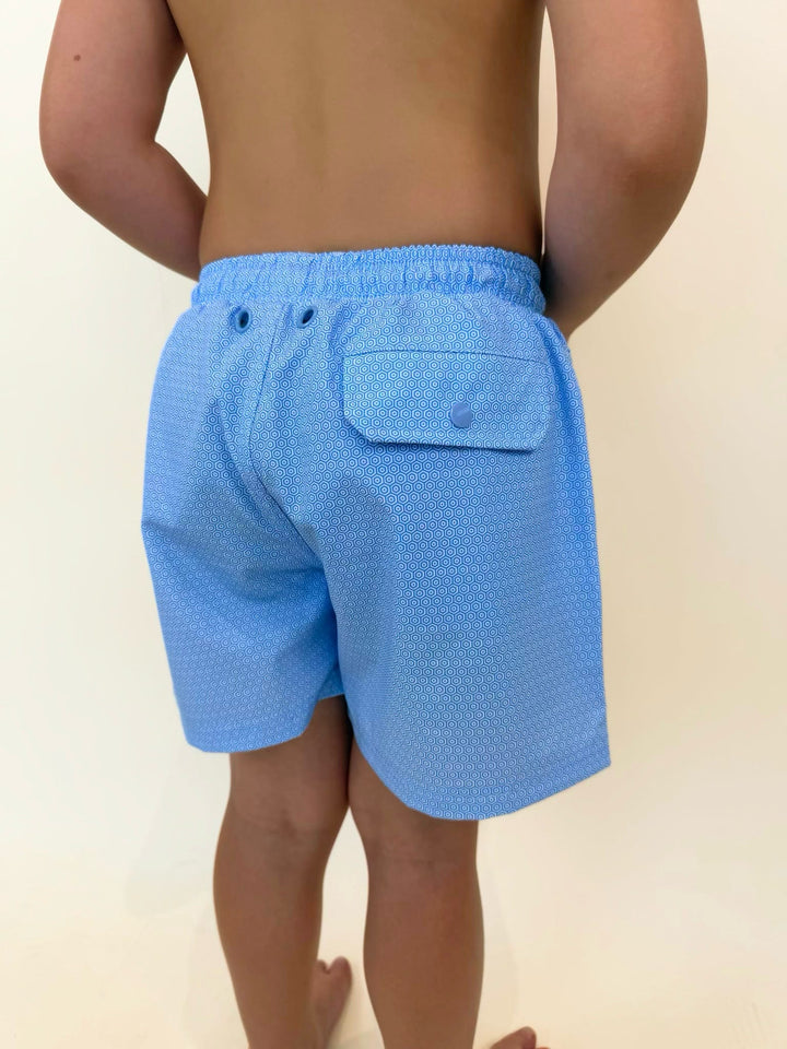 Fieldstone boys swim trunks back pocket detail, youth swim shorts with flap pocket, quick dry boys swimwear, kids patterned swim trunks, boys fishing and beach shorts, light blue performance swim trunks, southern youth swimwear