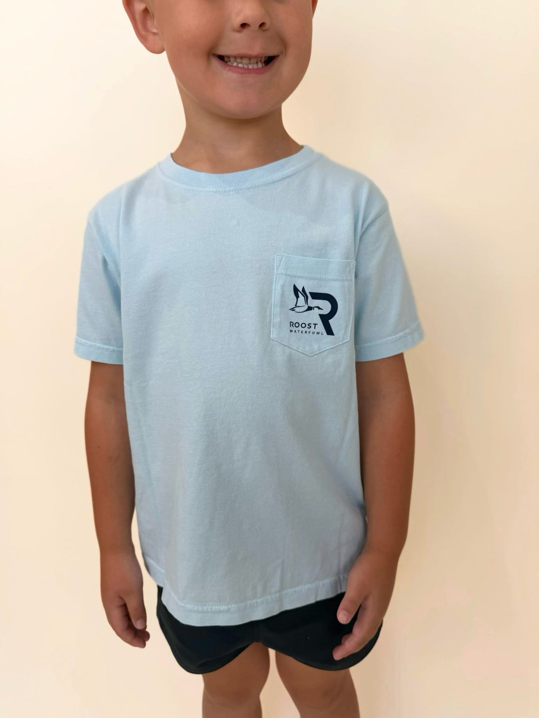 Roost Waterfowl youth pocket t-shirt, boys light blue hunting shirt, kids outdoor graphic tee, youth waterfowl apparel, boys casual pocket tee, southern boys clothing, Roost Waterfowl logo shirt