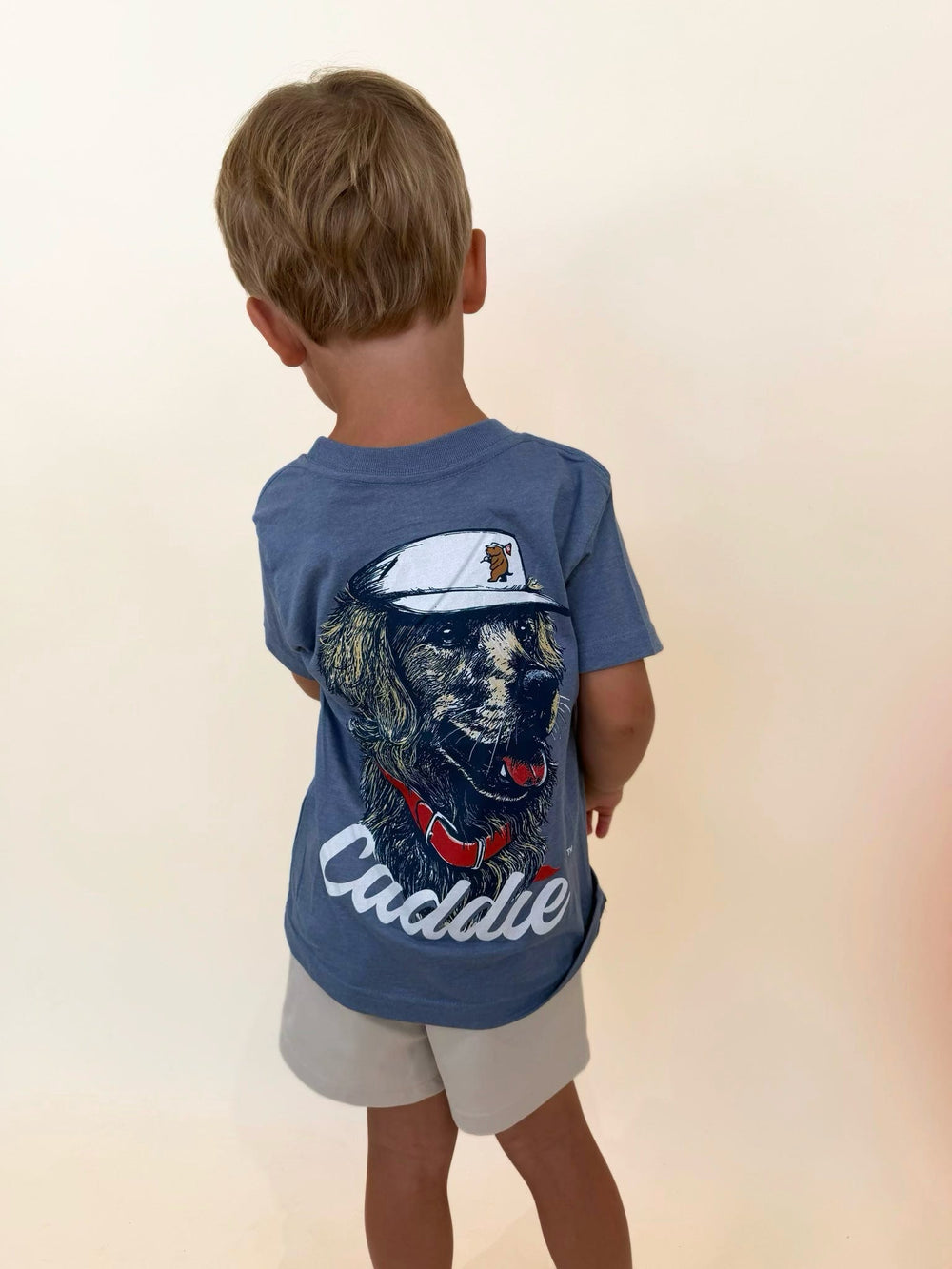Youth golden retriever graphic t-shirt, boys dog graphic tee, Caddie youth shirt, boys golf lifestyle apparel, youth southern clothing, boys outdoor graphic tee, blue pocket t-shirt for boys, retriever dog graphic shirt