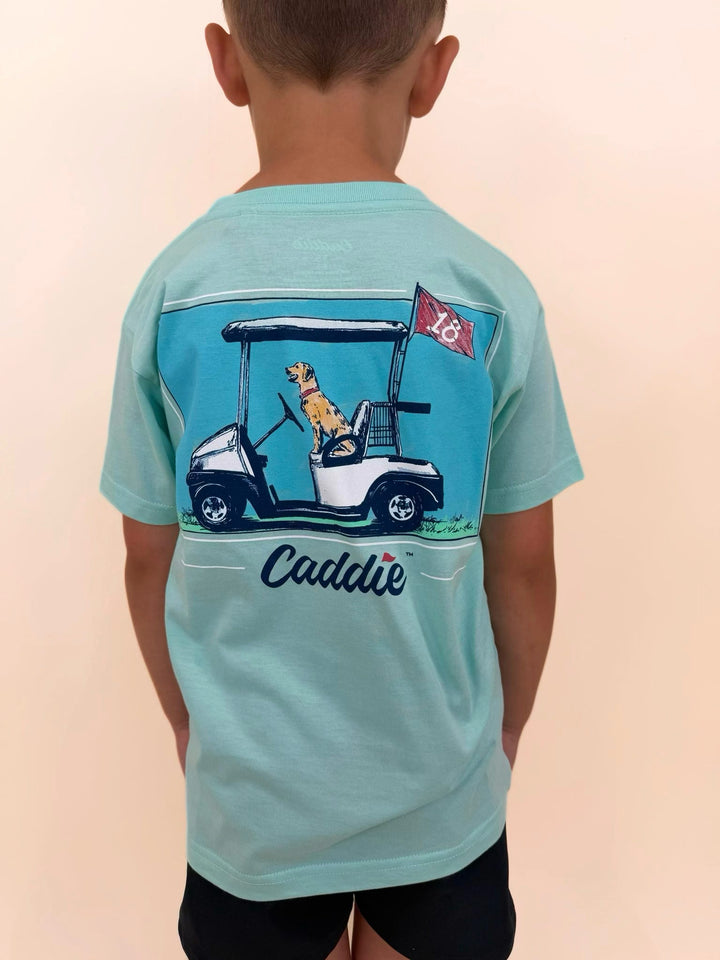 Youth Caddie graphic t-shirt featuring golf cart, Labrador retriever, and golf flag design, boys golf-themed shirt, outdoor lifestyle apparel for kids