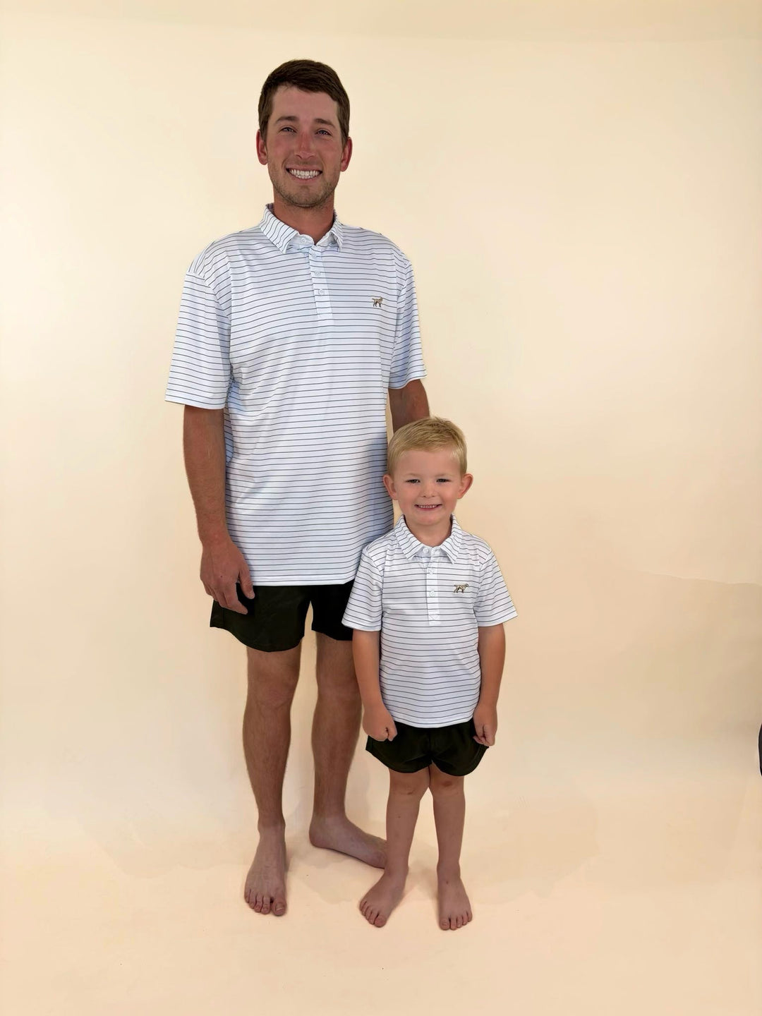 Matching father and son Fieldstone performance polos, white polo shirts with green pinstripes, family golf apparel, coordinated father-son southern style clothing