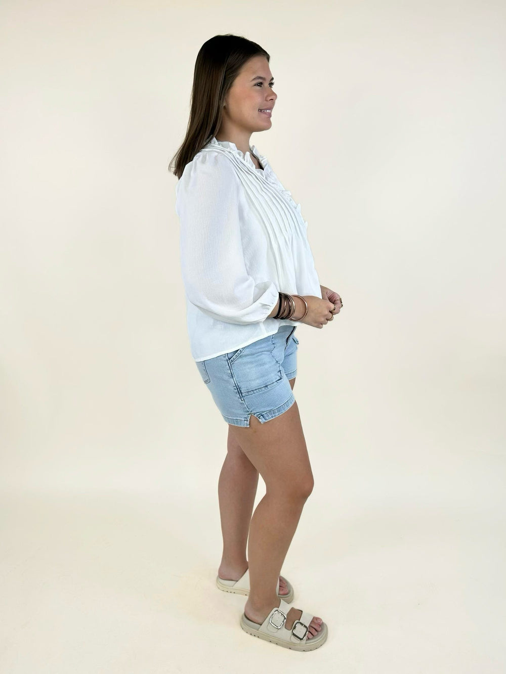 Side view of Dear John light wash high-rise denim shorts featuring front patch pockets, soft stretch denim, and a flattering everyday fit.