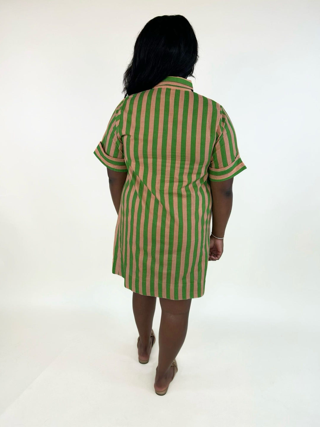 Back view of the THML Weekend Getaway Striped Shirt Dress in green with peach vertical stripes, featuring a relaxed fit, rolled short sleeves, and lightweight 100% cotton fabric.