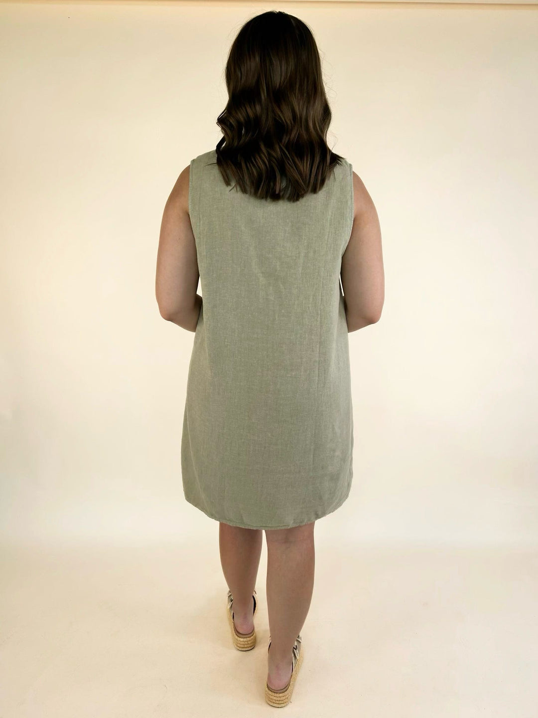 Back view of the Dear John Riri sleeveless mini dress in Abbey Stone featuring a relaxed fit and curved hemline.
