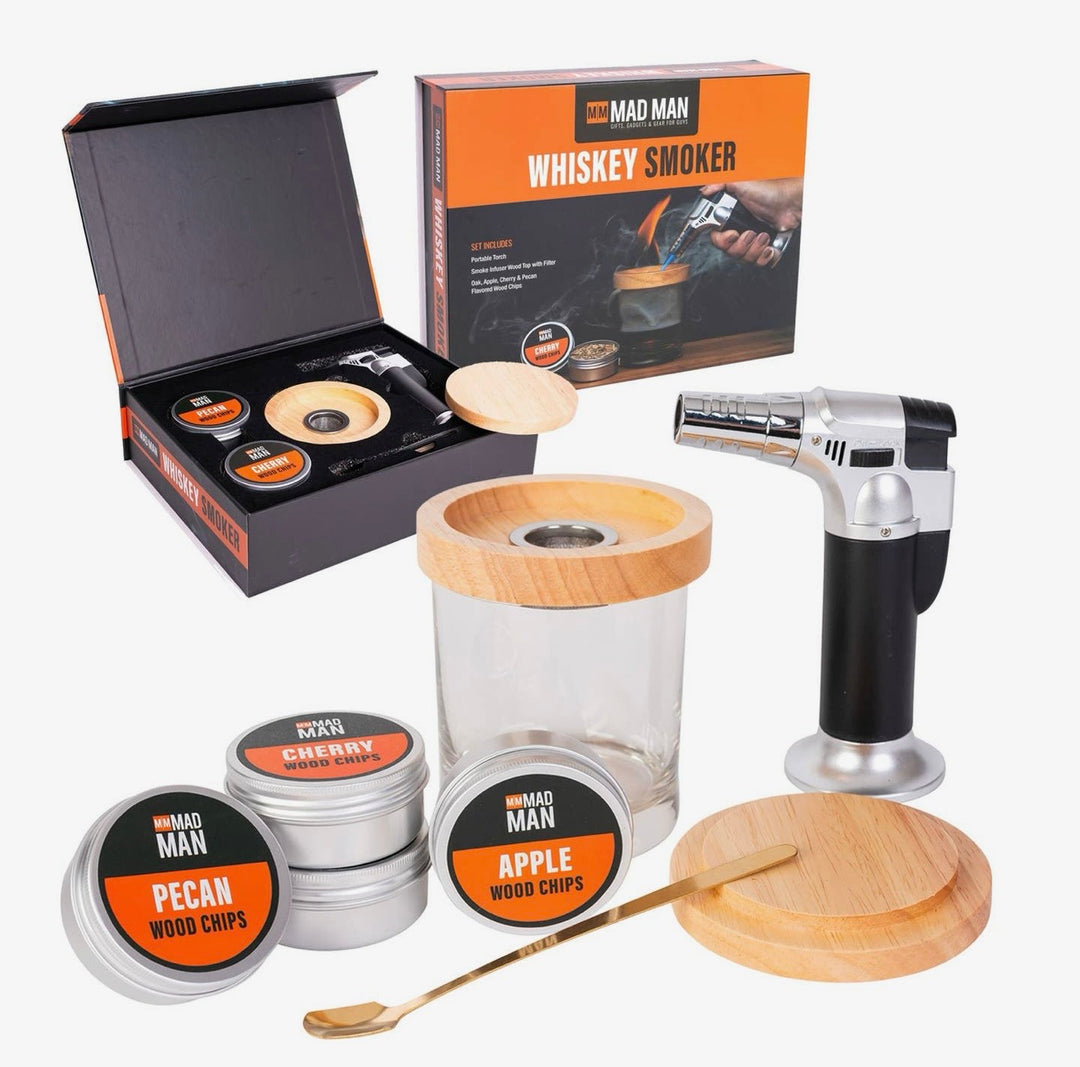 Complete Mad Man Whiskey Smoker kit with butane torch, smoke infuser, wooden lid, cocktail spoon, glass, and apple, cherry, and pecan wood chips.