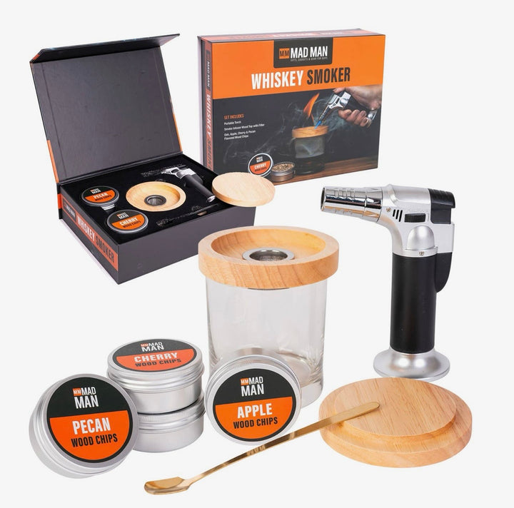 Complete Mad Man Whiskey Smoker kit with butane torch, smoke infuser, wooden lid, cocktail spoon, glass, and apple, cherry, and pecan wood chips.
