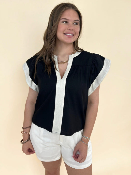 THML black and ivory contrast blouse with flutter sleeves and split neckline