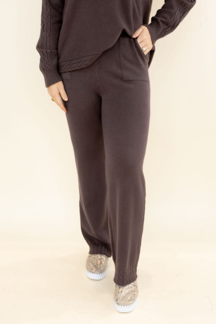 Front view of chocolate brown knit lounge pants highlighting the relaxed wide leg silhouette and full-length hem