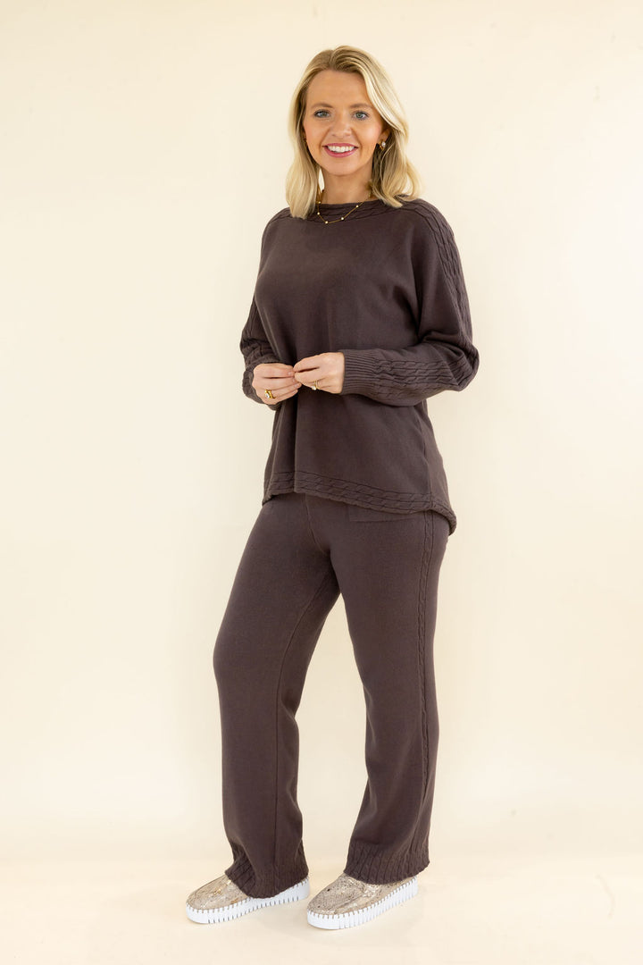 Woman modeling chocolate brown knit pullover and matching wide leg pants featuring a relaxed comfortable silhouette