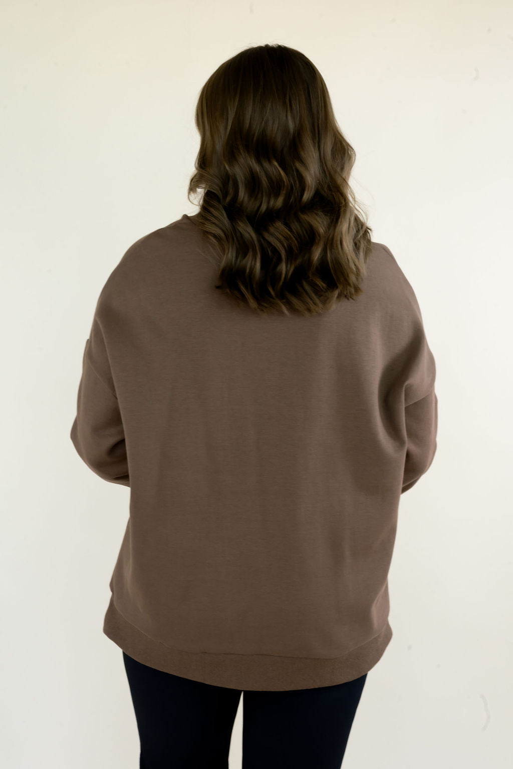 Back view of brown Reversible Thankful &amp; Blessed Mockneck Sweatshirt showing solid design, relaxed fit, and ribbed hem