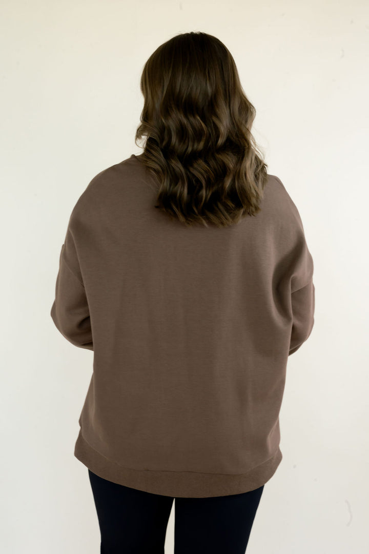 Back view of brown Reversible Thankful &amp; Blessed Mockneck Sweatshirt showing solid design, relaxed fit, and ribbed hem