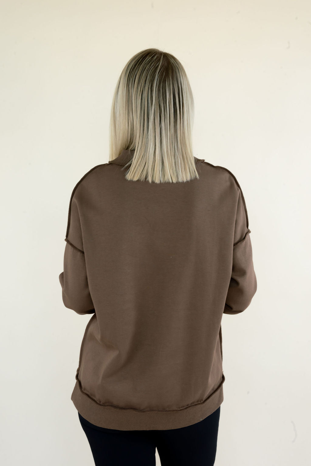 Back view of brown Reversible Thankful &amp; Blessed Mockneck Sweatshirt showing solid brown back, long sleeves, and relaxed silhouette