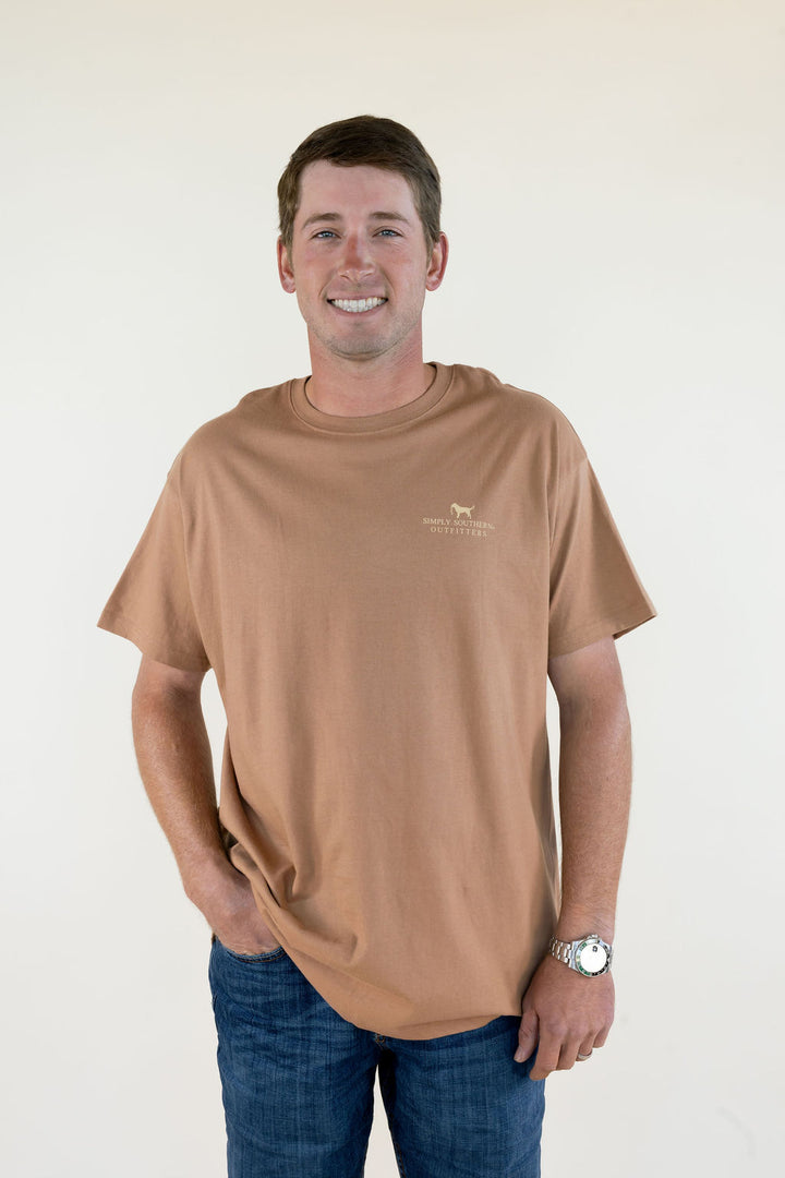 Front view of tan Marsh &amp; Retrievers men’s short sleeve T-shirt featuring a crew neckline, relaxed fit, and small chest logo