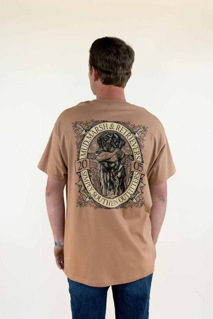 Man modeling tan Marsh &amp; Retrievers Southern Outdoors graphic T-shirt featuring a large outdoor retriever and hunting-inspired back design with blue jeans