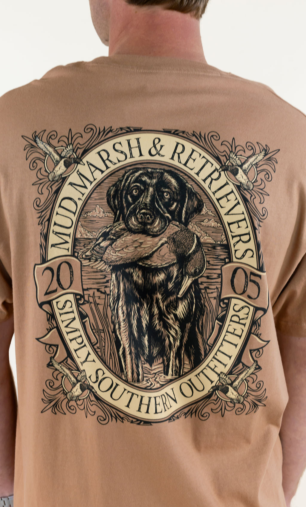 Close-up back view of tan Marsh &amp; Retrievers Southern Outdoors T-shirt highlighting the large retriever hunting graphic and vintage-inspired outdoor design