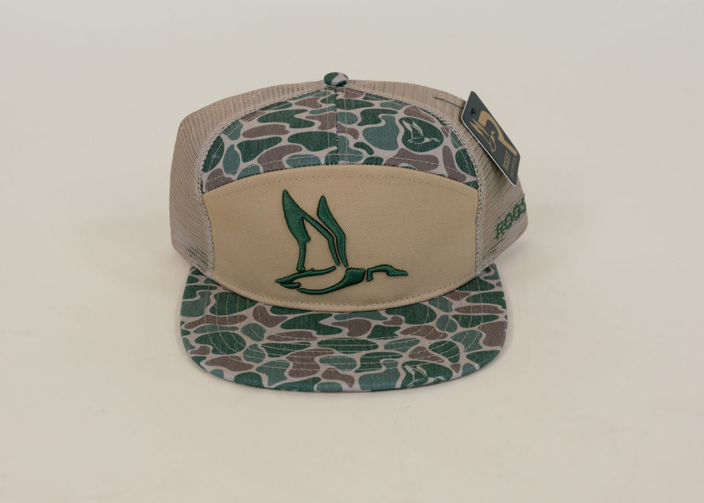 Tan and green camouflage waterfowl trucker hat featuring embroidered green duck logo, camo flat bill, and tan mesh back