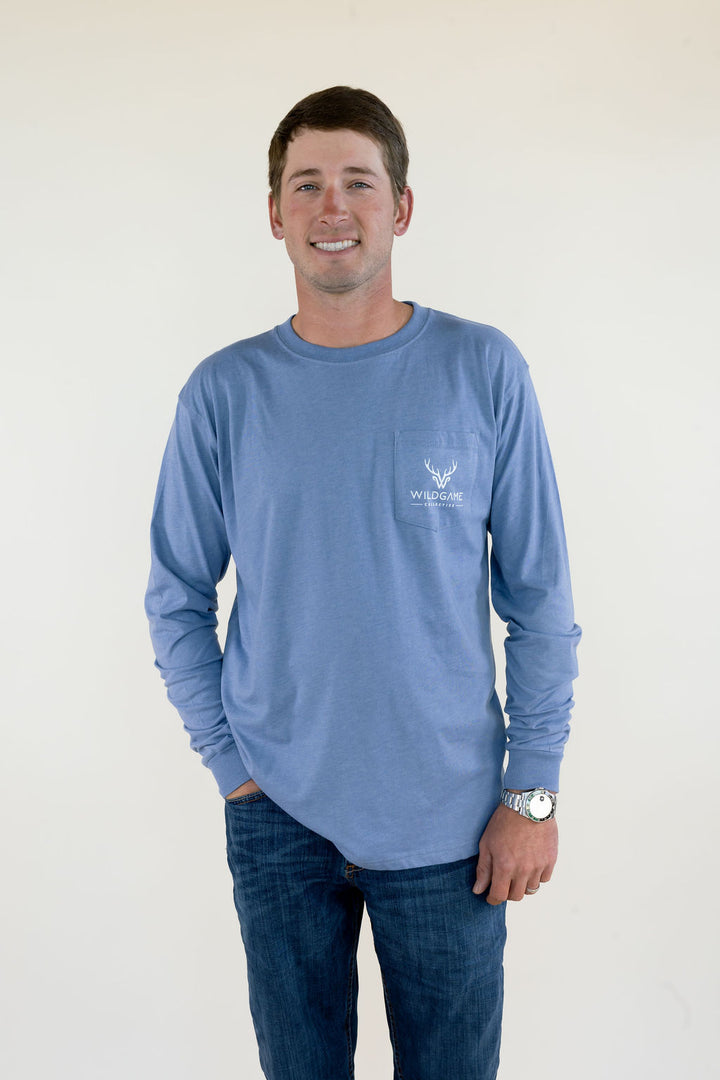 Front view of blue Wildgame men’s long sleeve shirt featuring crew neckline, relaxed fit, and small chest logo