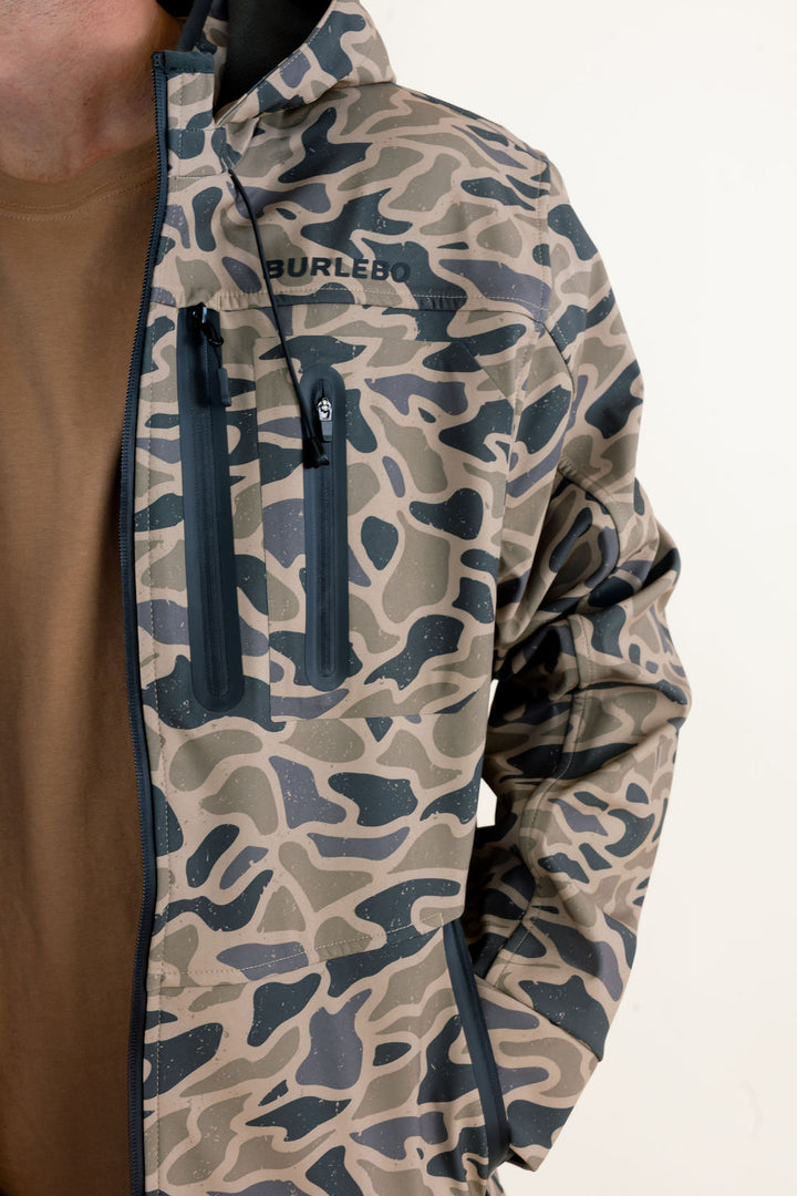 Close-up of the Burlebo Challenger Jacket in Gauge Camo showing the camo print, zipper, chest detail and outer fabric.