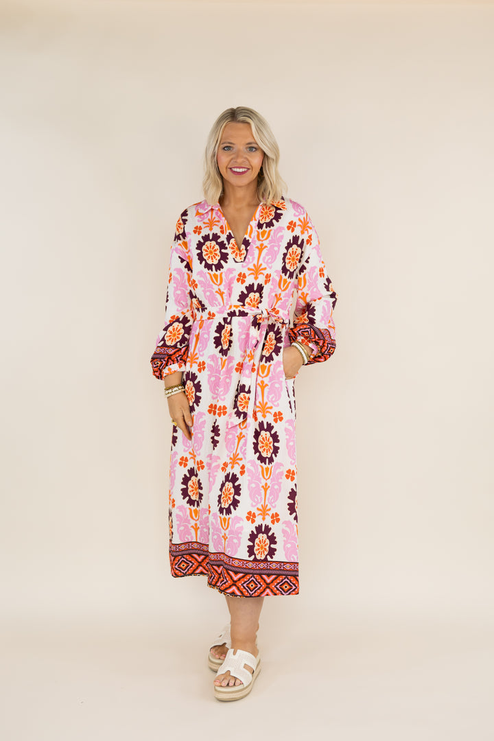 Woman wearing THML Marigold Bloom floral tie waist midi dress, full front view