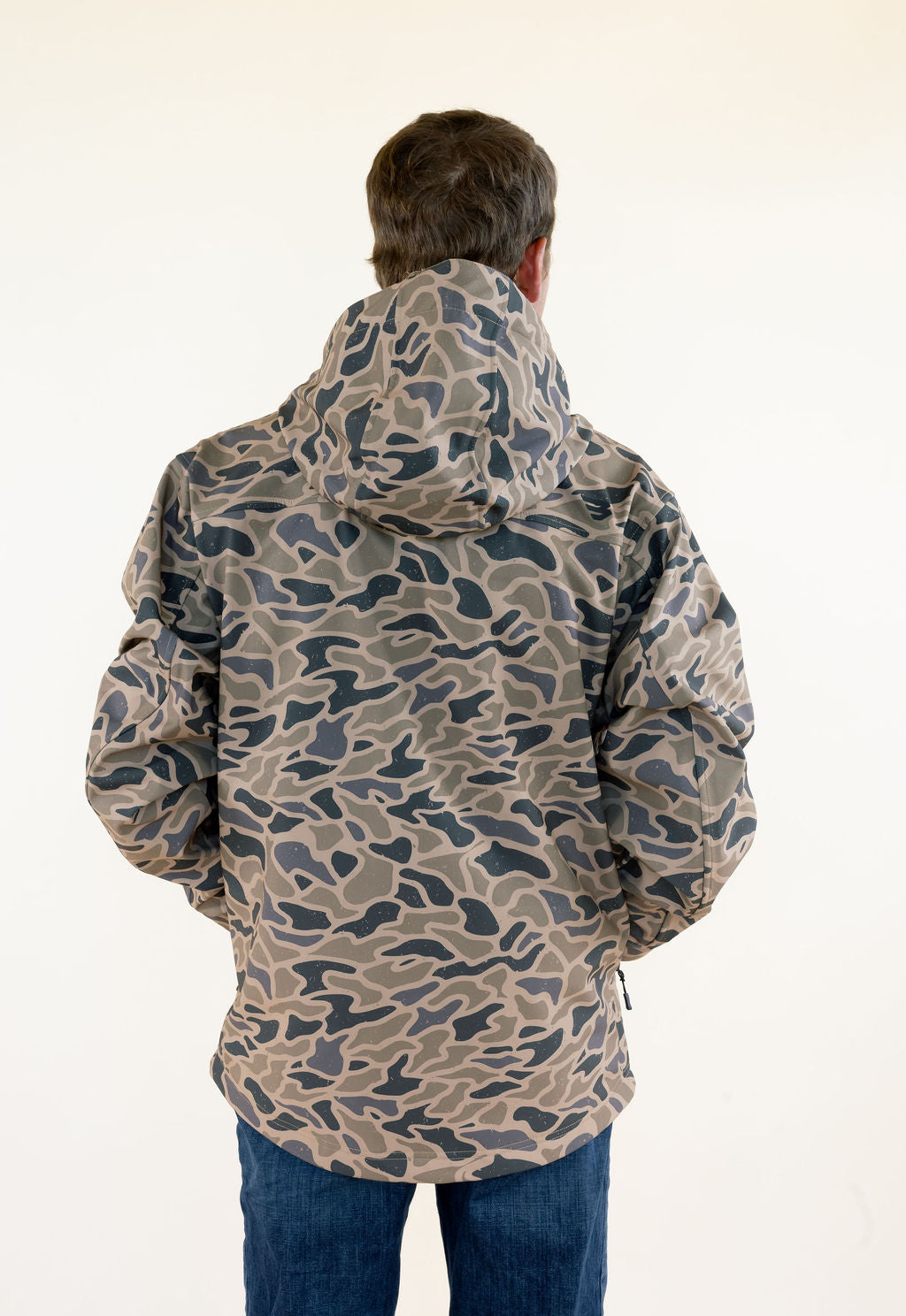 Back view of male model wearing the Burlebo Challenger Jacket in Gauge Camo showing the full camouflage pattern and rear coverage.