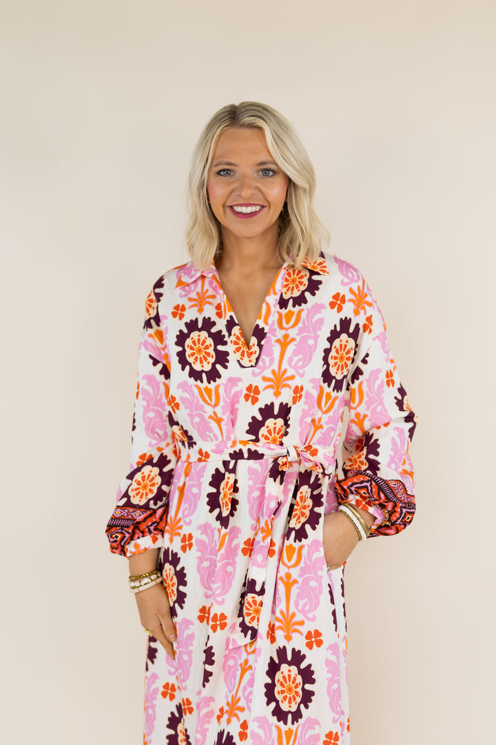 Woman modeling THML Marigold Bloom pink multi floral tie waist midi dress