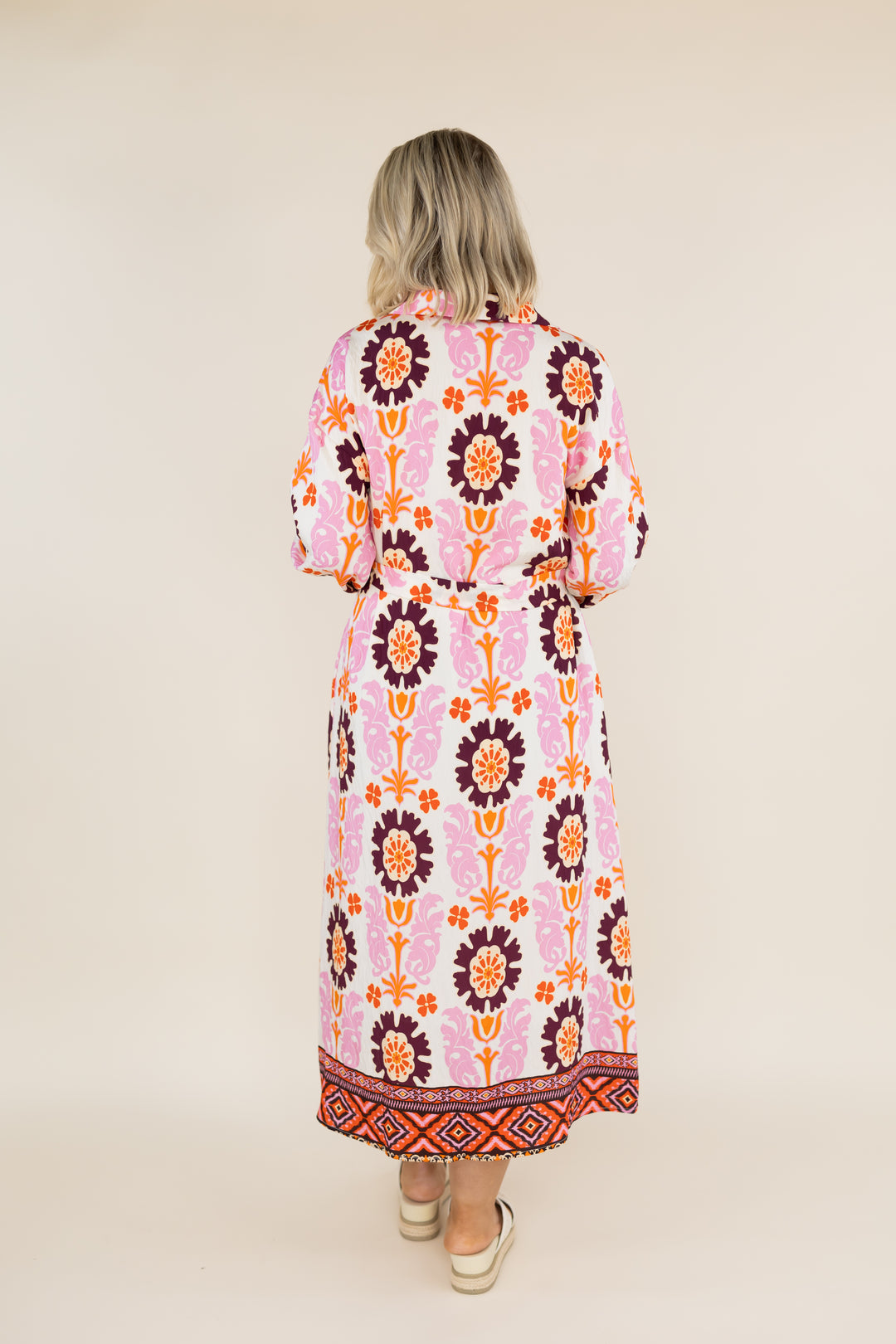 Back view of THML Marigold Bloom long sleeve floral midi dress