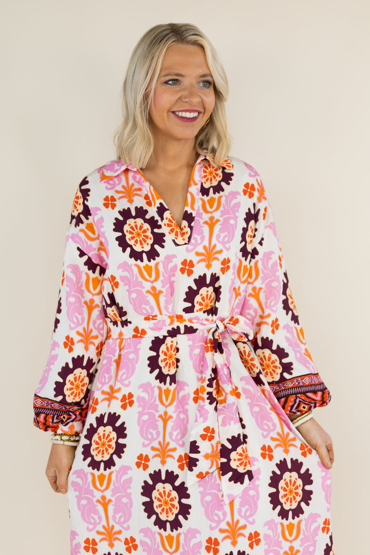Front detail of THML Marigold Bloom midi dress with tie waist and balloon sleeves